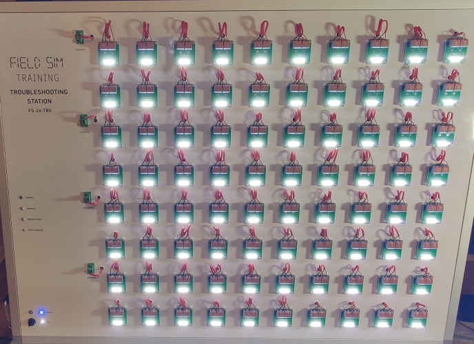 The front of the FS-24-TBS Troubleshooting Station in Active mode with the LEDs on all 80 devices illuminated.